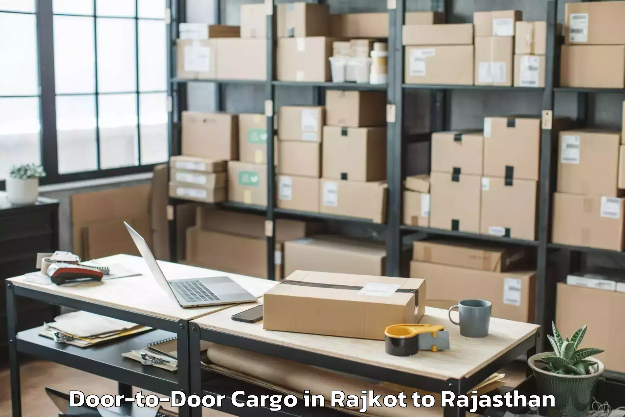 Reliable Rajkot to Opjs University Churu Door To Door Cargo